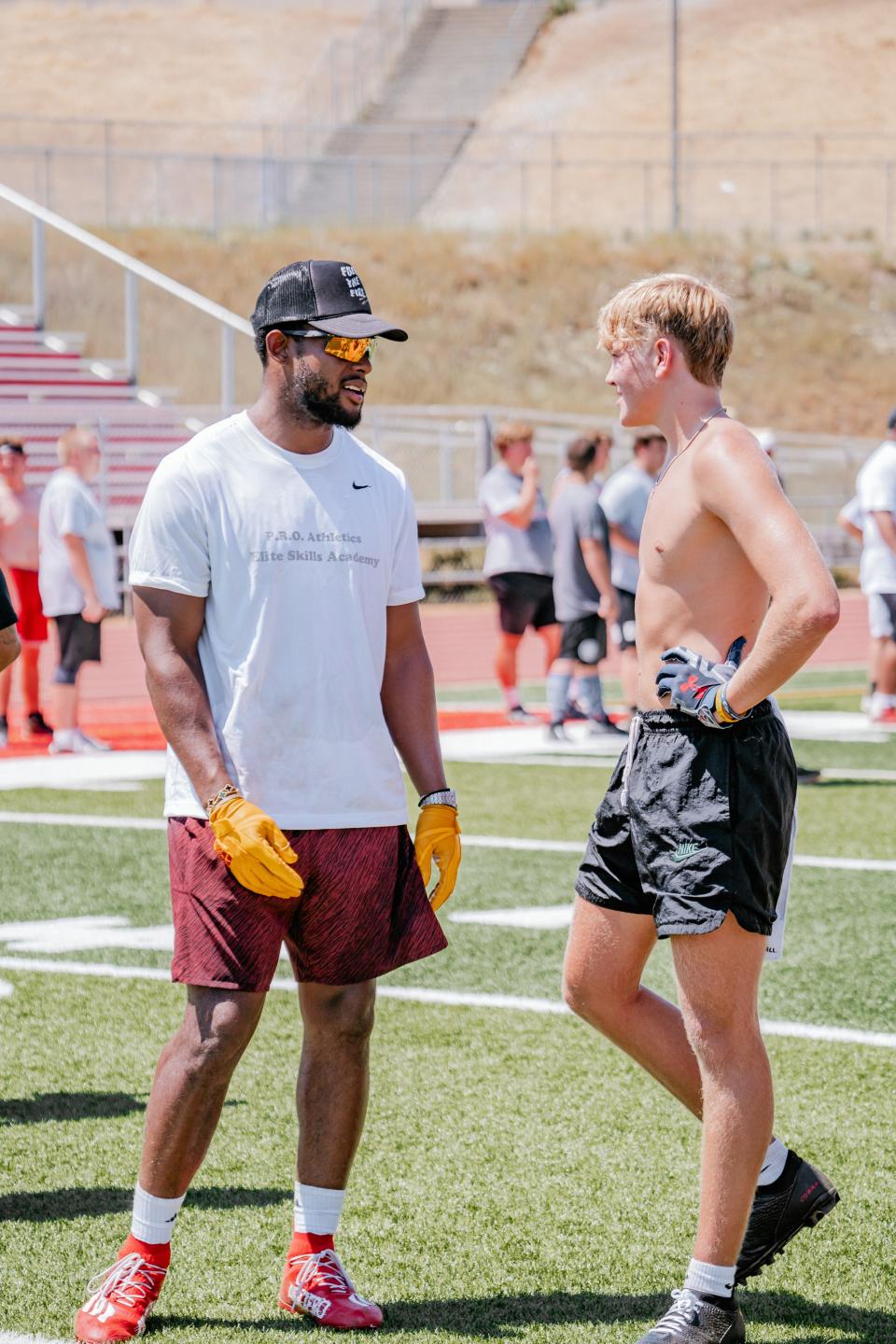 New England Patriots wide receiver Juju Smith-Schuster gives advice to Redding native Dallas Clark, a senior who now attends Smithson Valley High School in Spring Branch, Texas. Smith-Schuster gave players advice on how to run creative routes, strengthen their footwork and advice he received as a youngster growing up in Los Angeles.