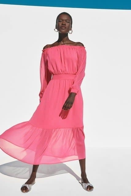 model wearing the pink dress