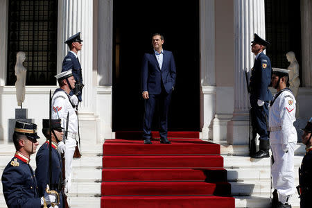 Greek Prime Minister Alexis Tsipras waits to welcome French President Emmanuel Macron at the Maximos Mansion in Athens, Greece, September 7, 2017. Picture taken September 7, 2017. REUTERS/Alkis Konstantinidis