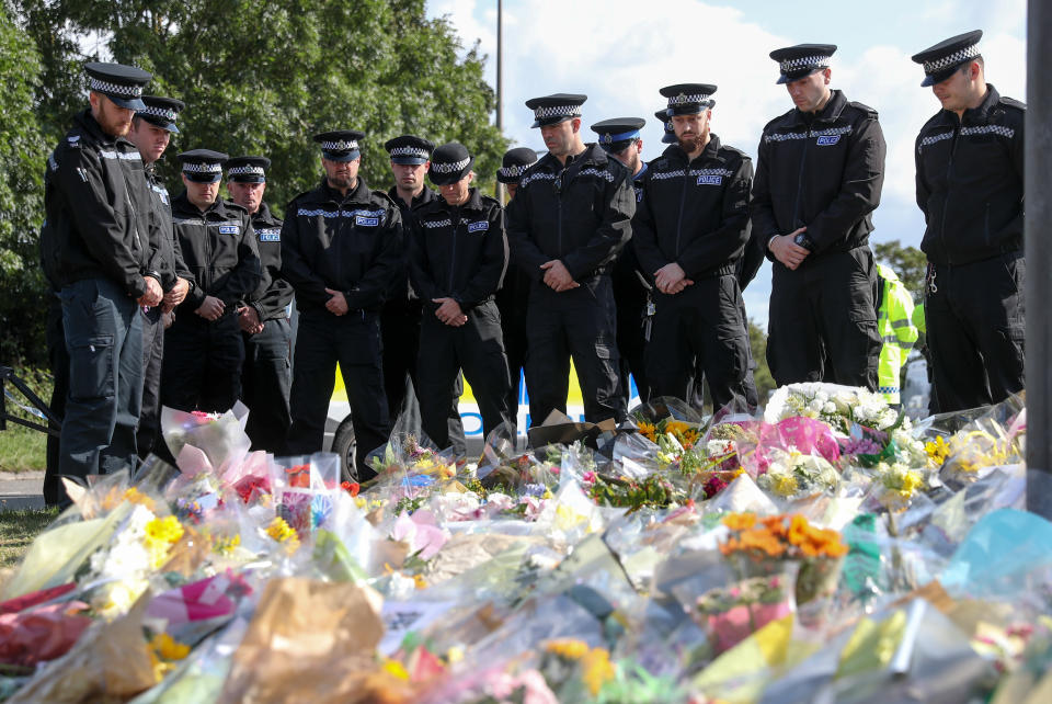 Police officers gather to pay their respects at the scene near Ufton Lane, Sulhamstead, Berkshire, where Thames Valley Police officer Pc Andrew Harper, 28, died on Thursday near the village of Sulhamstead in Berkshire.