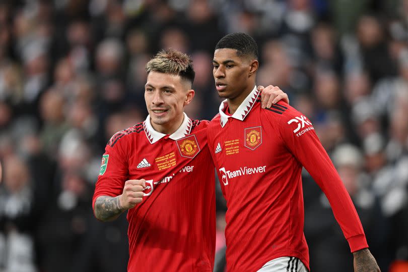 Lisandro Martinez hugs Marcus Rashford after the latter's goal in the 2023 League Cup final.