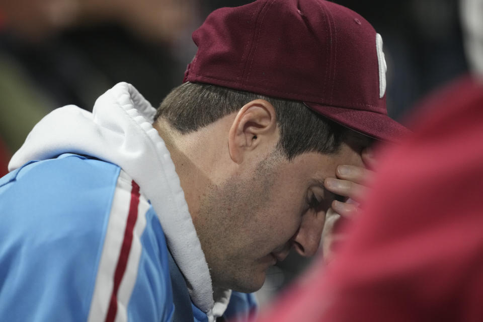 A Philadelphia Phillies fans watches play during the eighth inning in Game 5 of baseball's World Series between the Houston Astros and the Philadelphia Phillies on Thursday, Nov. 3, 2022, in Philadelphia.(AP Photo/David J. Phillip)