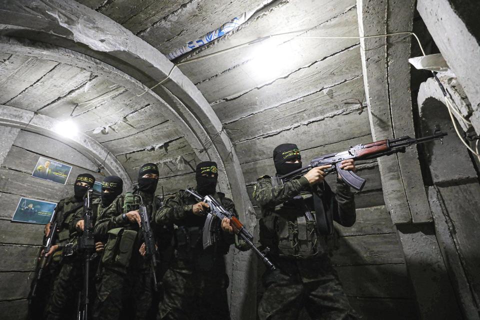Members of Al-Quds Brigades, an armed wing of Islamic Jihad Movement, keep guard at tunnels on Gaza-Israeli border against a possible attack by Israeli forces in Gaza City, Gaza on March 30, 2023.