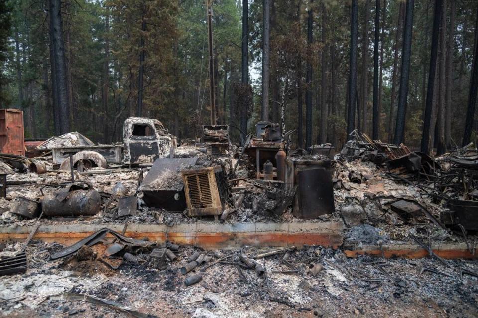 Destroyed cars and other equipment sit in the wreckage of Dennis Fischer’s 1,500 square foot shop at his home in Forest Ranch on Wednesday. “I don’t think anything’s gonna polish up,” Fischer said.