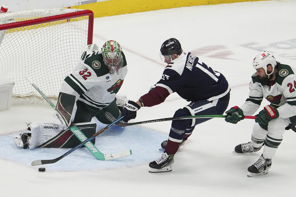 Colorado Avalanche right wing Valeri Nichushkin (13) takes a shot against Minnesota Wild goaltender Filip Gustavsson (32) in the third period of an NHL hockey game Tuesday, April 9, 2024, in Denver. (AP Photo/Bart Young)