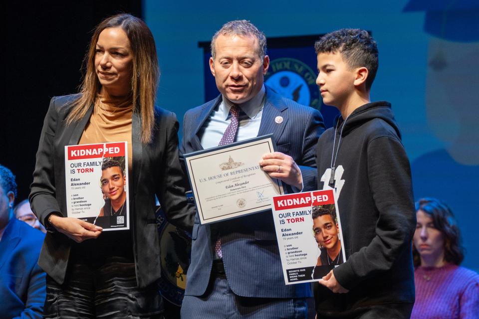 The family of Edan Alexander accept a Hometown hero award on his behalf as he is being held hostage by Hamas militants in Gaza. US Congressman Josh Gottheimer presented the awards to members of his congressional district at an event at the Bergen PAC in Englewood, NJ on Friday Dec. 15, 2023. Edan's mother, Yael Alexander, and brother, Roy Alexander, 12, accepted the award on stage.