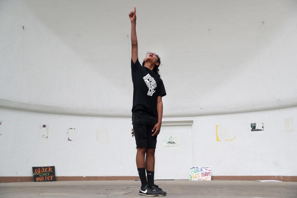 J'Manuel Cortes performs his poetry during a poetry slam competitions at a Juneteenth celebration at Highland Bowl in 2020.