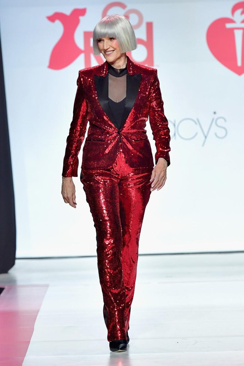 Maye Musk wearing a sparkling red suit on the carpet