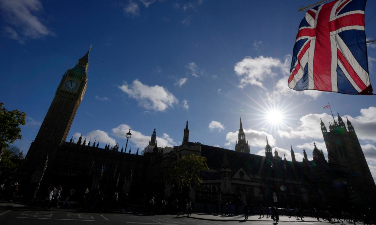 <span>The Houses of Parliament in London: 11 MPs listed roles worth more than £100,000 a year. </span><span>Photograph: Kirsty Wigglesworth/AP</span>