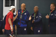 Tommy Paul of the USA is congratulated by his coaches after a singles Davis Cup qualifier tennis match between Uzbekistan and the USA against Khumoyun Sultanov of Uzbekistan in Tashkent, Uzbekistan, Friday, Feb. 3, 2023. (AP Photo)