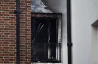 Damage can be seen to a low-rise block of buildings affected by a fire in Bethnal Green, northeast London, Britain, June 24, 2017. REUTERS/Hannah McKay