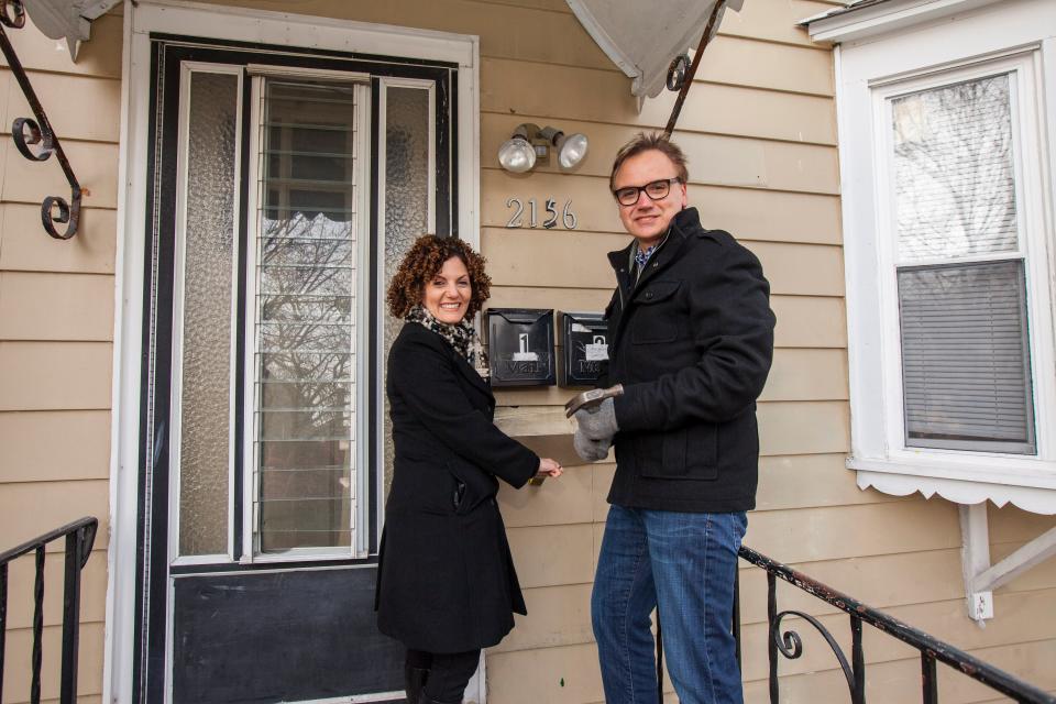 Dina Benadon and Brent Young on the porch of Walt Disney's childhood home.