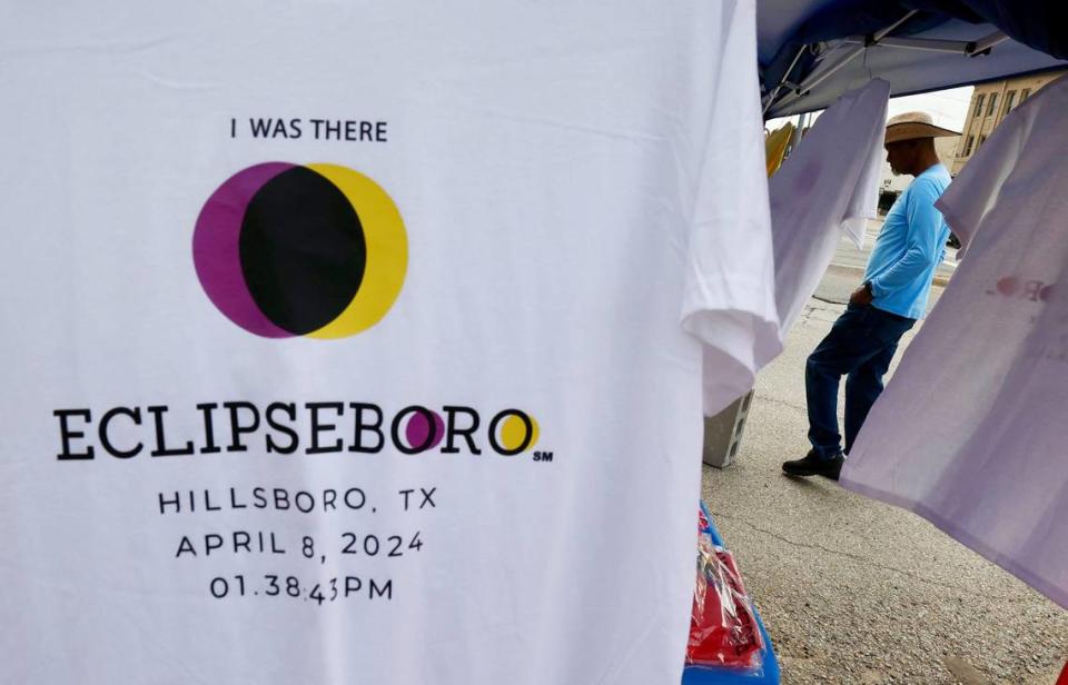 Earnest Whitfield looks through the ‘Eclipseboro’ shirts and merchandise being sold outside the Hillsboro Courthouse on Monday, April 8, 2024. Chris Torres/ctorres@star-telegram.com