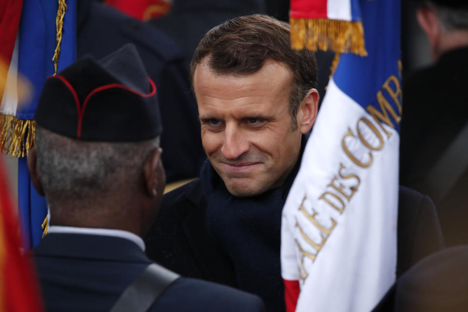 French President Emmanuel Macron meets veterans under the Arc de Triomphe during commemorations marking the 101st anniversary of the 1918 armistice, ending World War I, Monday Nov. 11, 2019 in Paris (AP Photo/Francois Mori, Pool)