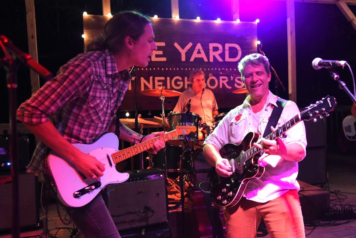 Bastrop musicians Ben Zuniga, left, drummer Pete Langhans and Phil Hurley perform at a Bastrop Live Music Foundation showcase at Neighbor’s Kitchen and Yard in December, one of a series of musical performances the foundation has hosted since summer 2023.