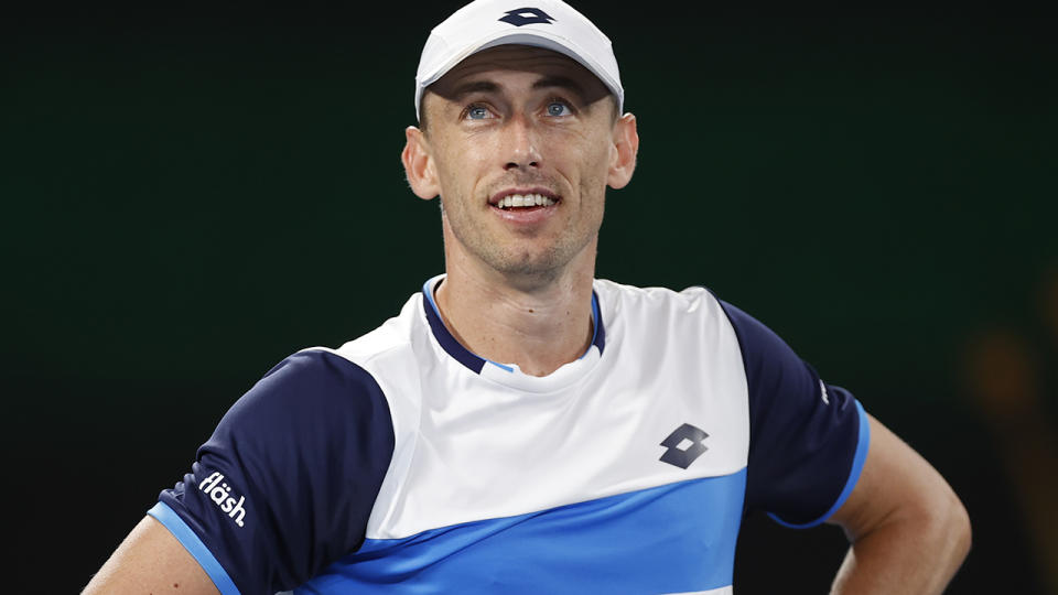 John Millman, pictured here in action against Roger Federer at the Australian Open.