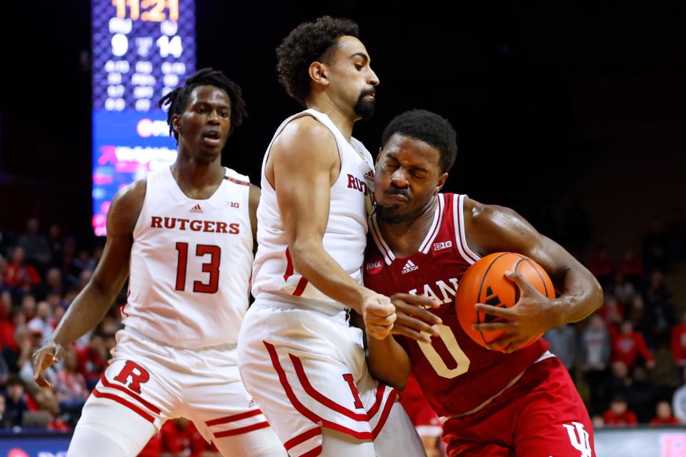 Xavier Johnson #0 of the Indiana Hoosiers collides with Noah Fernandes #2 of the Rutgers Scarlet Knights driving to the basket in the first half at Jersey Mike's Arena on January 9, 2024 in Piscataway, New Jersey. Rutgers defeated Indiana 66-57.