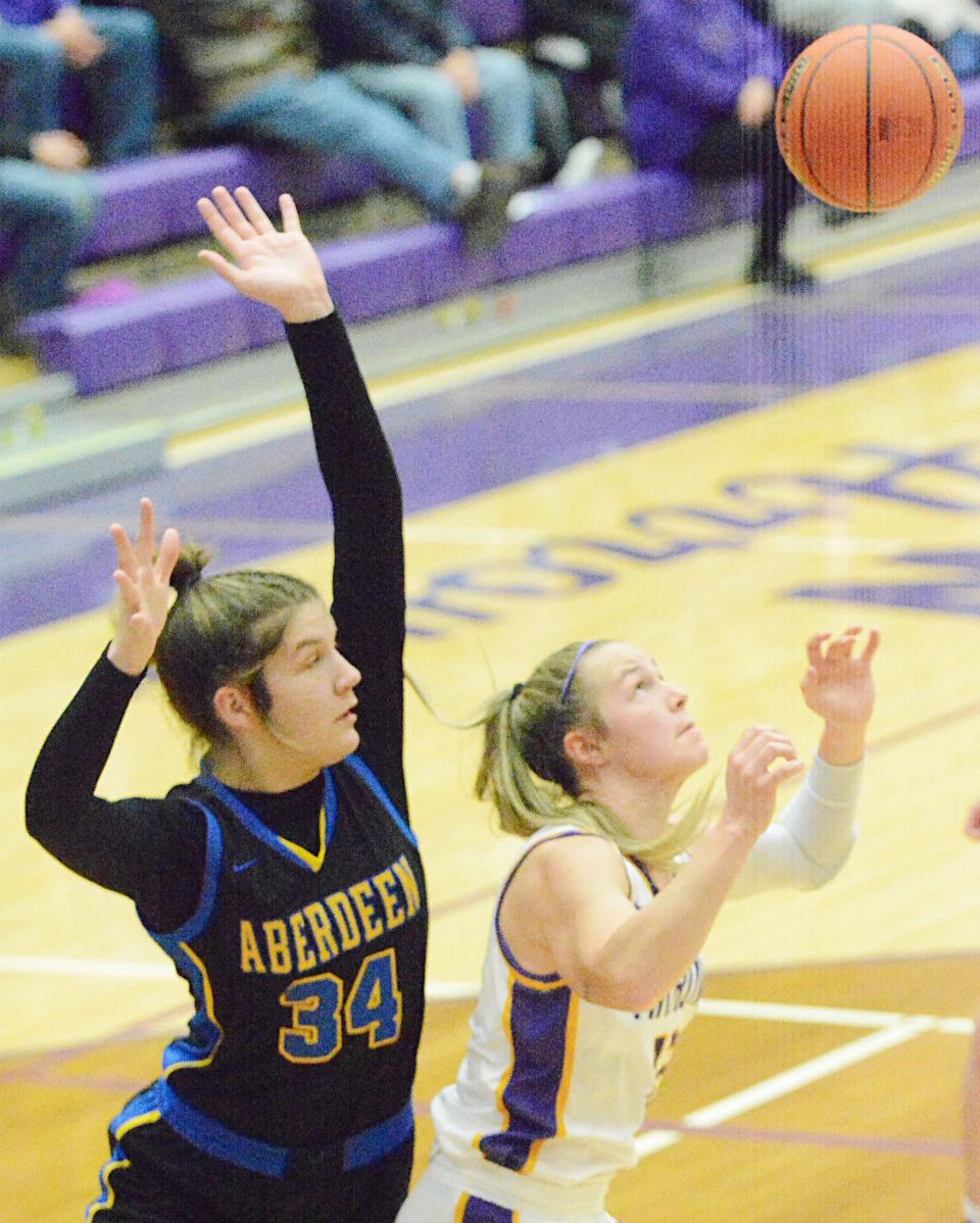 Aberdeen Central's Lauryn Burckhard (34) and Watertown's Jaida Young battle for the ball during their high school girls basketball game on Monday, Feb. 20, 2023 in the Watertown Civic Arena.