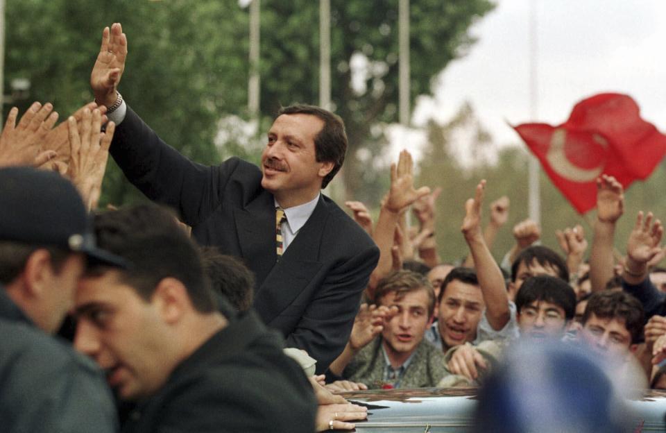 FILE - Recep Tayyip Erdogan, mayor of Istanbul, waves to his supporters after a press conference in Istanbul, on Sept. 24, 1998. Erdogan, who is seeking a third term in office as president in elections in May, marks 20 years in office on Tuesday, March 14, 2023. (AP Photo/Murad Sezer, File)