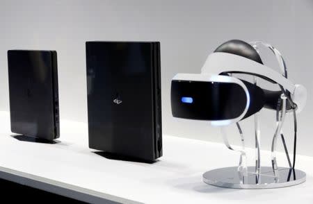 Sony's PlayStation 4, PlayStation 4 Pro and PlayStation VR headset (L-R) are displayed at Tokyo Game Show 2016 in Chiba, east of Tokyo, Japan, September 15, 2016. REUTERS/Kim Kyung-Hoon/File Photo