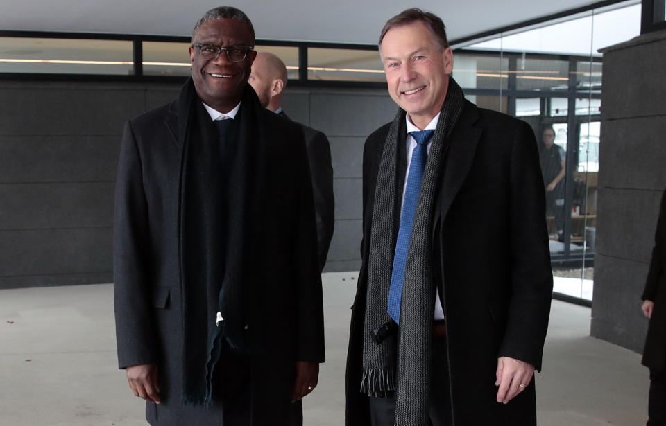 Dr. Denis Mukwege, left, is welcomed by director of the Norwegian Nobel Institute Olav Njolstad on his arrival at Oslo Airport in Gardermoen, Norway, Saturday, Dec. 8, 2018. Dr. Denis Mukwege from Kongo and Nadia Murad from Iraq received the Nobel Peace Prize this year for their efforts to end the use of sexual violence as a weapon of war and armed conflict. (Hakon Mosvold Larsen/NTB scanpix via AP)