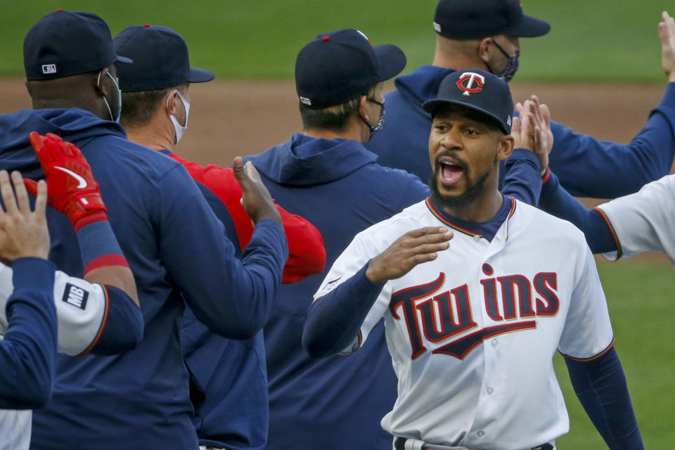 Minnesota Twins' Byron Buxton celebrates the team's 10-2 win over the Seattle Mariners in a baseball game Thursday, April 8, 2021, in Minneapolis. (AP Photo/Bruce Kluckhohn)