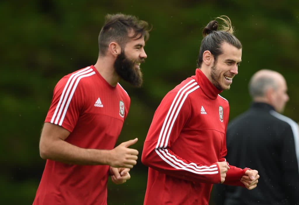 Former Wales midfielder Joe Ledley (left) says the country’s youngsters must handle the loss of Gareth Bale (right) in World Cup qualifiers (Joe Giddens/PA) (PA Archive)