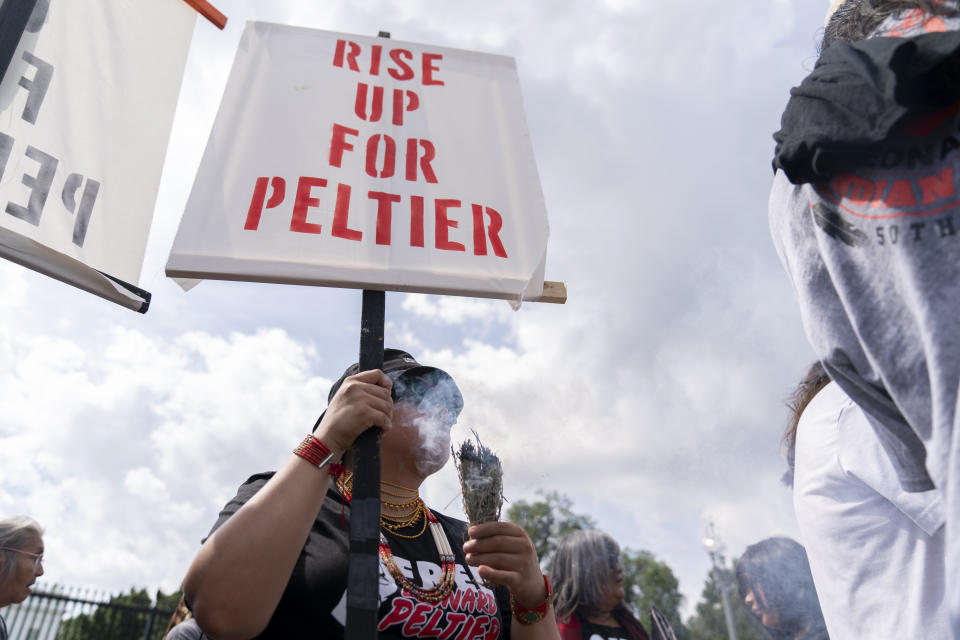 People gather for a rally outside of the White House in support of imprisoned Native American activist Leonard Peltier, Tuesday, Sept. 12, 2023, in Washington. (AP Photo/Stephanie Scarbrough)