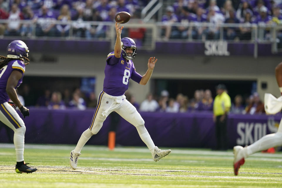 Minnesota Vikings quarterback Kirk Cousins (8) throws a pass during the first half of an NFL football game against the Arizona Cardinals, Sunday, Oct. 30, 2022, in Minneapolis. (AP Photo/Abbie Parr)