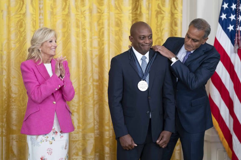 First Lady Jill Biden applauds as Deputy Secretary of the U.S. State Department Richard Verma awards Hank Willis Thomas a medal Wednesday during the 2023 International Medal of Arts Ceremony in the East Room of the White House in Washington, D.C. The award, selected by the U.S. State Department as part of the Art in Embassies program, honors those who have aided in promoting cultural diplomacy efforts worldwide. Photo by Bonnie Cash/UPI