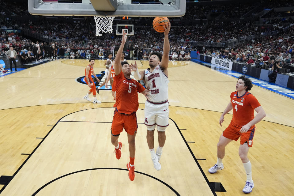 Alabama guard Mark Sears (1) shoots over Clemson forward Jack Clark (5) during the first half of an Elite 8 college basketball game in the NCAA tournament Saturday, March 30, 2024, in Los Angeles. (AP Photo/Ashley Landis)