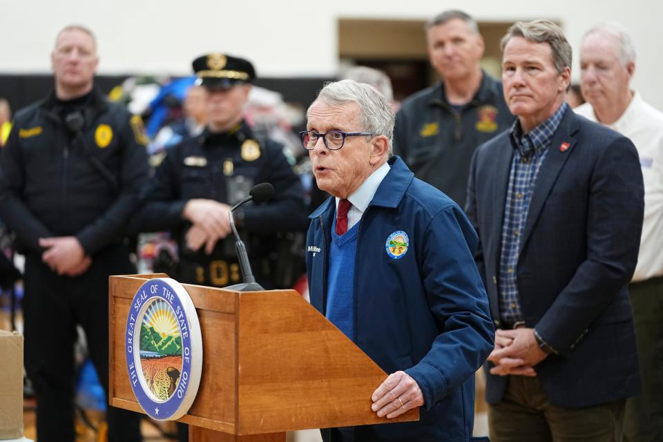 Surrounded by community donations, Ohio Gov. Mike DeWine speaks to members of the media Friday, March 15, 2024, inside the Indian Lake High School gym after a tornado struck the area the night before, killing three people.