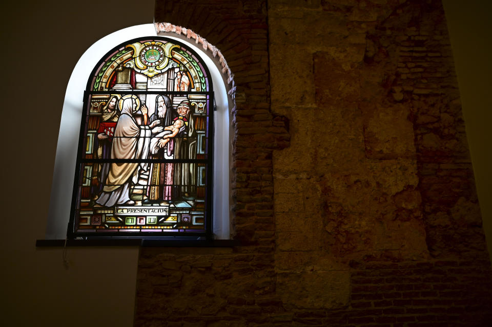 A stained glass window stands inside the San Jose Church, the second oldest Spanish church in the Americas, that will reopen following a massive reconstruction that took nearly two decades to complete in San Juan, Puerto Rico, Tuesday, March 9, 2021. It was a project many in Puerto Rico thought would fail given the never-ending funding problems. (AP Photo/Carlos Giusti)