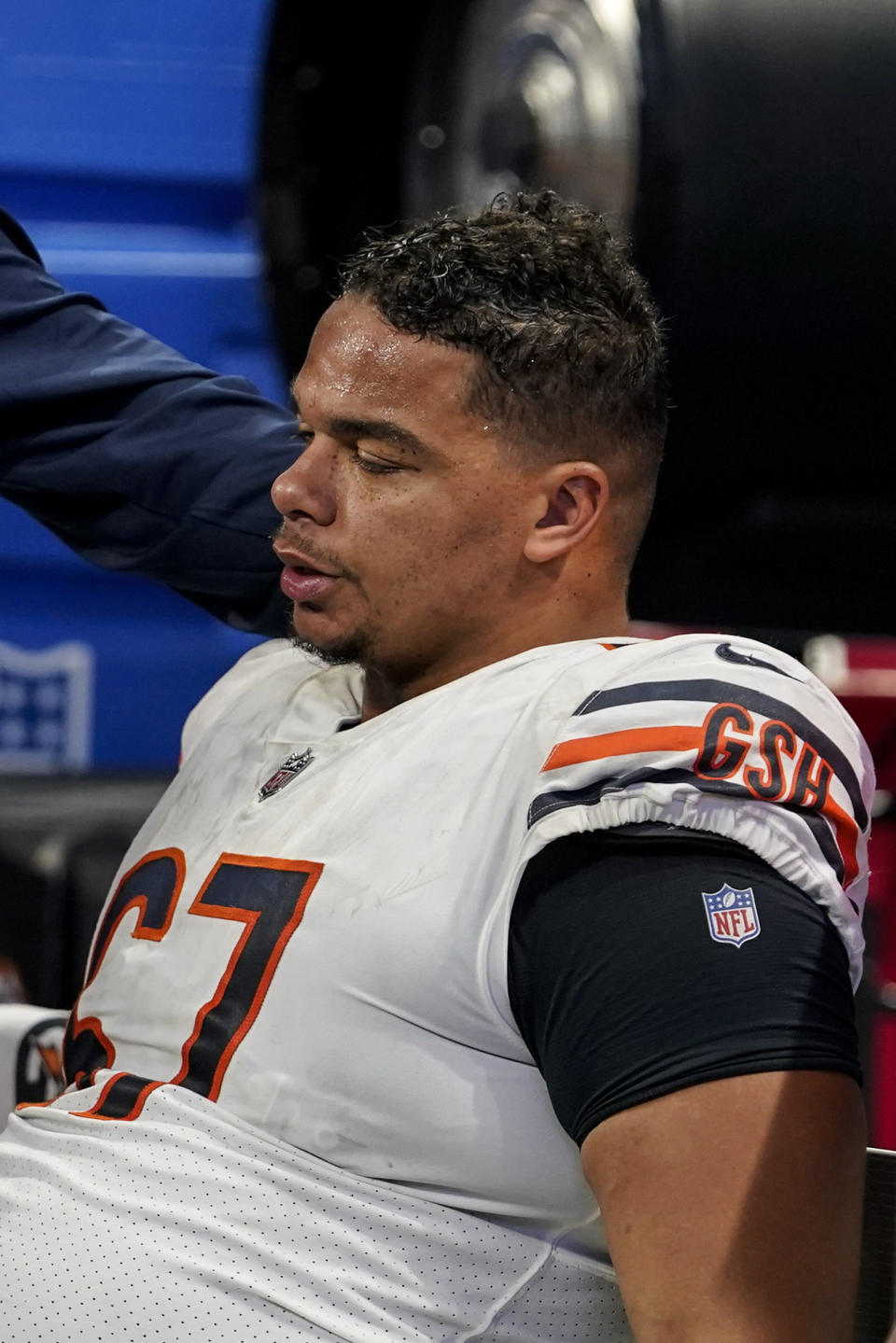 Chicago Bears center Sam Mustipher sits on the bench after an NFL football game between the Atlanta Falcons and the Chicago Bears, Sunday, Nov. 20, 2022, in Atlanta. The Atlanta Falcons won 27-24. (AP Photo/Brynn Anderson)