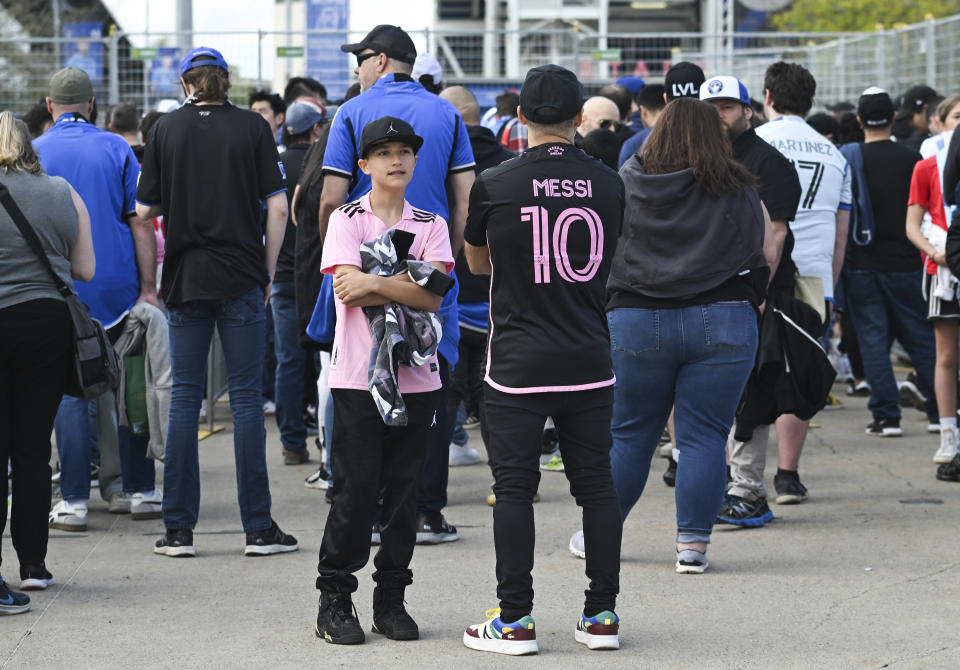 Lionel Messi fans wait to enter the stadium for an MLS soccer match between CF Montreal and Inter Miami in Montreal, Saturday, May 11, 2024. (Graham Hughes/The Canadian Press via AP)