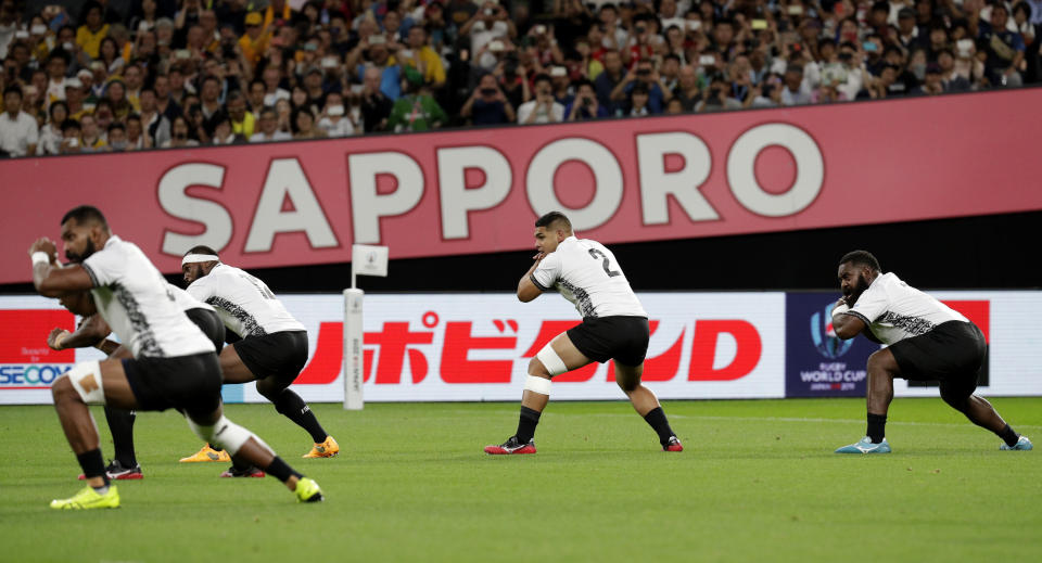 Fiji's performs their pre-match challenge the "Bole" prior to the start of the Rugby World Cup Pool D game at Sapporo Dome between Australia and Fiji in Sapporo, Japan, Saturday, Sept. 21, 2019. (AP Photo/Aaron Favila)