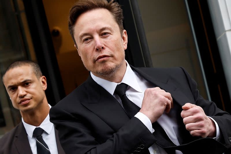 Tesla CEO Musk departs the company’s local office in Washington