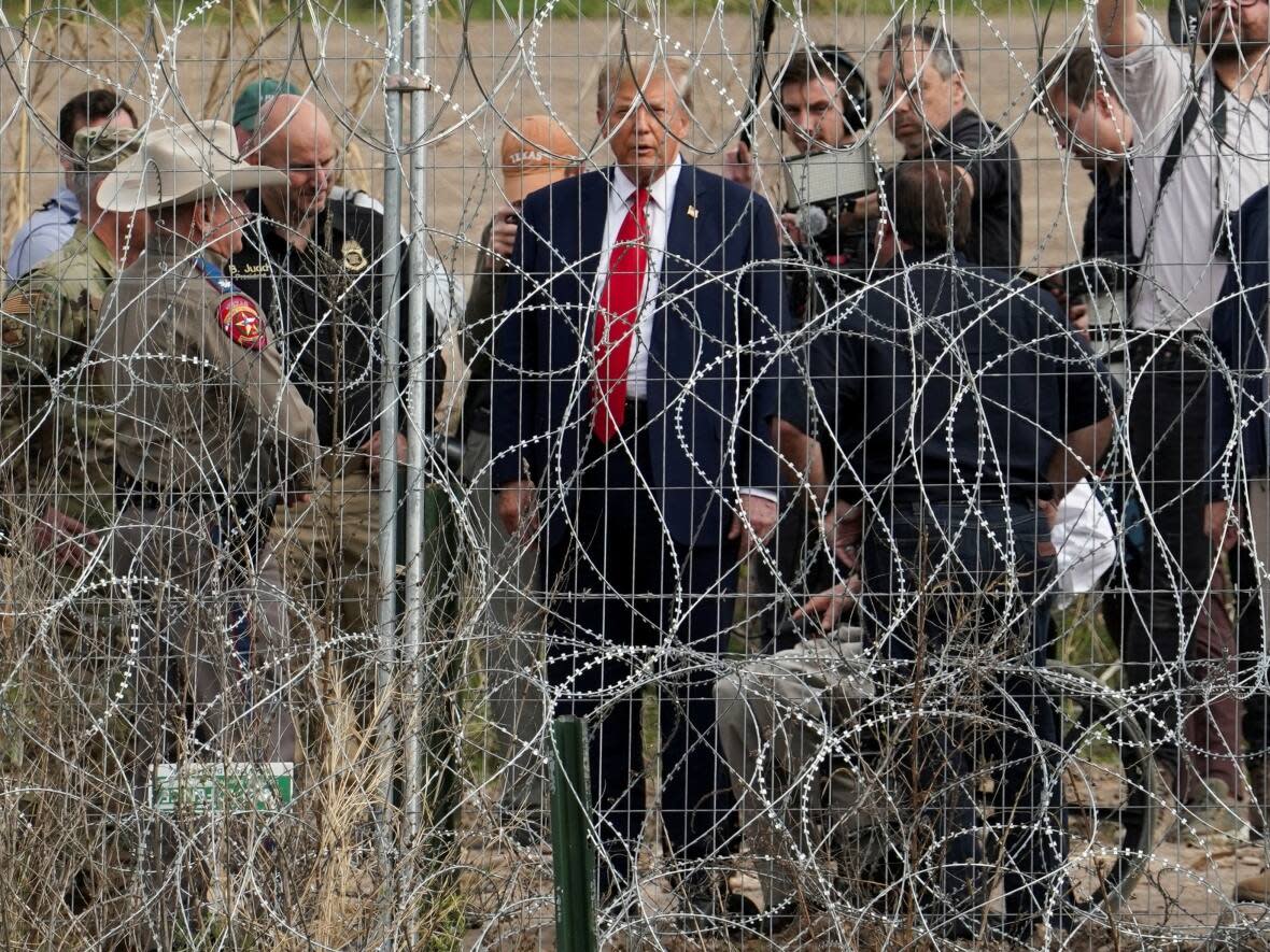 Former U.S. president Donald Trump visited the border at Eagle Pass, Texas, on Thursday. He offered support for the state government, which has erected razor wire without federal permission. (Go Nakamura/Reuters - image credit)