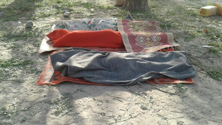 Bodies covered with blankets are pictured in Rann, northeast Nigeria on January 17, 2017 after an an air force jet accidentally bombarded a camp for displaced people