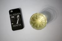 A mobile phone cover with a picture of Russian President Vladimir Putin which reads "Russian Mafia" is seen in this photo illustration taken in a hotel room in Kazan, Russia, August 5, 2015. REUTERS/Stefan Wermuth