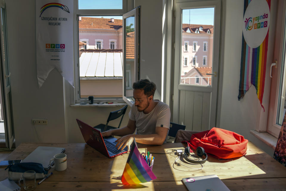 SPoD LGBTQ association lobbyist Ogulcan Yediveren works in his office in Istanbul, Monday, Sept. 19, 2022. SPoD, which stands for Social Policies, Gender Identity and Sexual Orientation Studies Association. (AP Photo/Khalil Hamra)