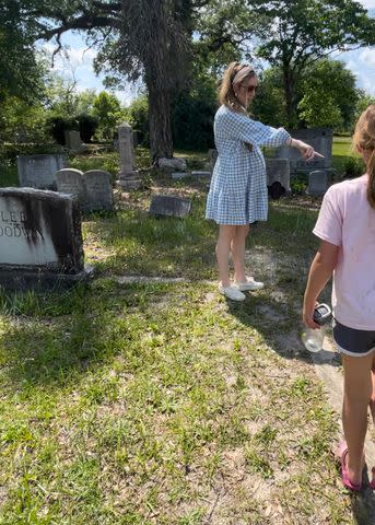 <p>Courtesy of Haley Hodge</p> Haley Hodge with her kids looking for names at a cemetery