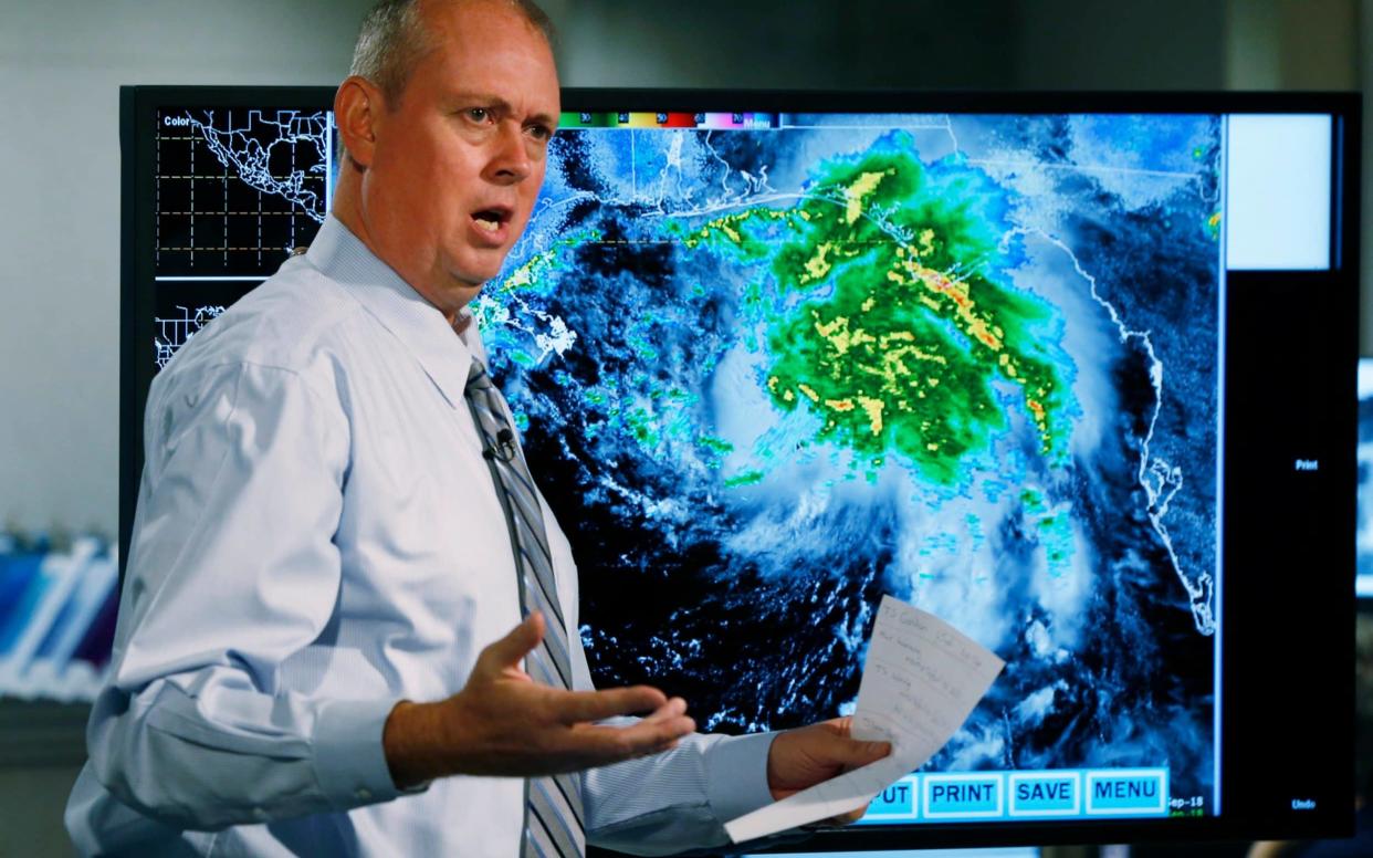 Ken Graham, director of the National Hurricane Centre speaks during a broadcast warning of the approaching storm - AP
