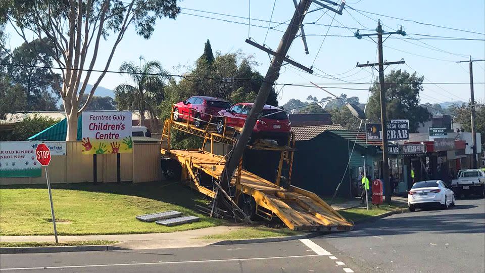 The car carrier took out a power pole before smashing through the fence of a Victorian childcare centre. Source: Supplied