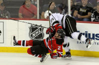 NEWARK, NJ - JUNE 09: Dustin Penner #25 of the Los Angeles Kings collides with Marek Zidlicky #2 of the New Jersey Devils during Game Five of the 2012 NHL Stanley Cup Final at the Prudential Center on June 9, 2012 in Newark, New Jersey. (Photo by Jim McIsaac/Getty Images)