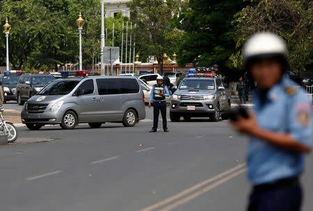 Police vehicles escort Kem Sokha, former leader of the Cambodia National Rescue Party (CNRP), back to jail after a bail hearing at the Appeal Court in Phnom Penh, Cambodia, February 1, 2018. REUTERS/Samrang Pring