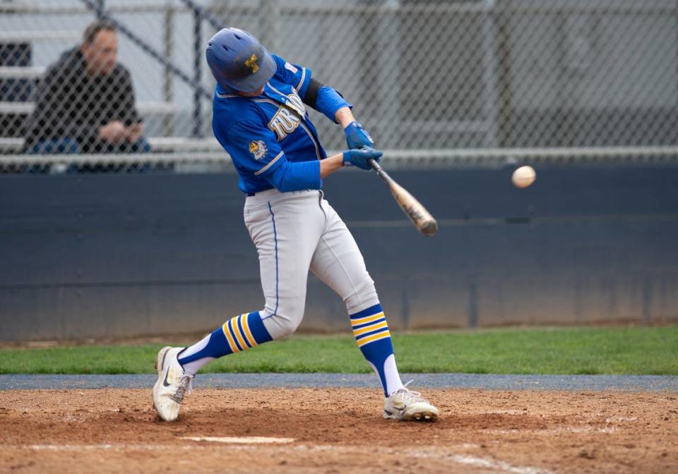 Turlock’s Carson Gonzales singles during the Central California Athletic league game with Downey at Downey High School in Modesto, Calif., Thursday, March 23, 2023.