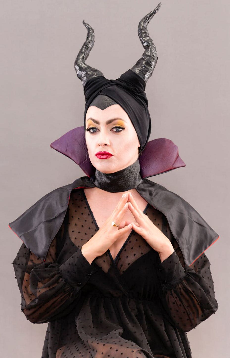 Mischievous woman dressed as Maleficent.