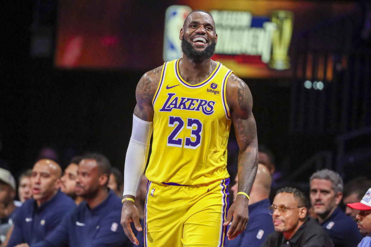 Los Angeles Lakers forward LeBron James smiles after being fouled while shooting against the New Orleans Pelicans during a semifinal in the NBA in-season tournament on Dec. 7, 2023, in Las Vegas. (AP Photo/Ian Maule)