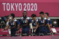 Japan players leave the pitch after their men's rugby sevens match against Britain at the 2020 Summer Olympics, Monday, July 26, 2021 in Tokyo, Japan. (AP Photo/Shuji Kajiyama)